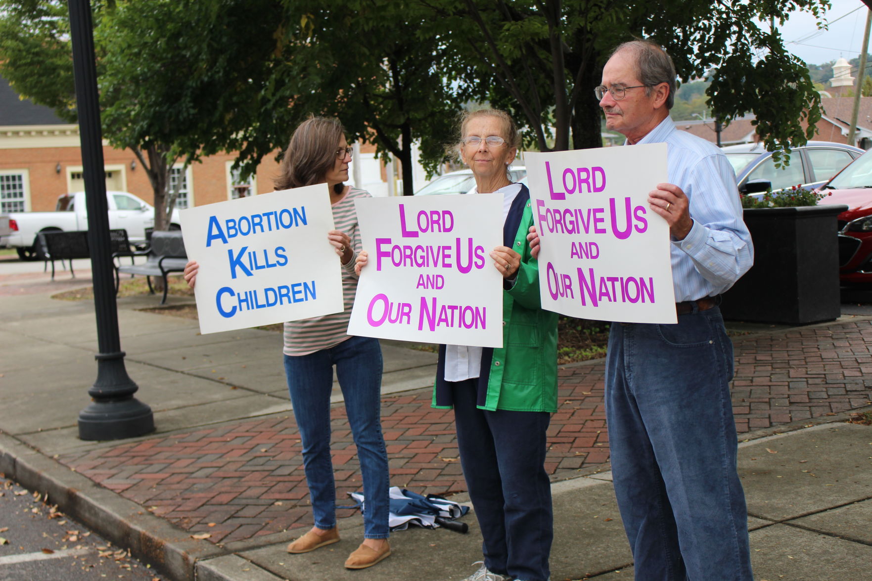Pregnancy Center holds signs